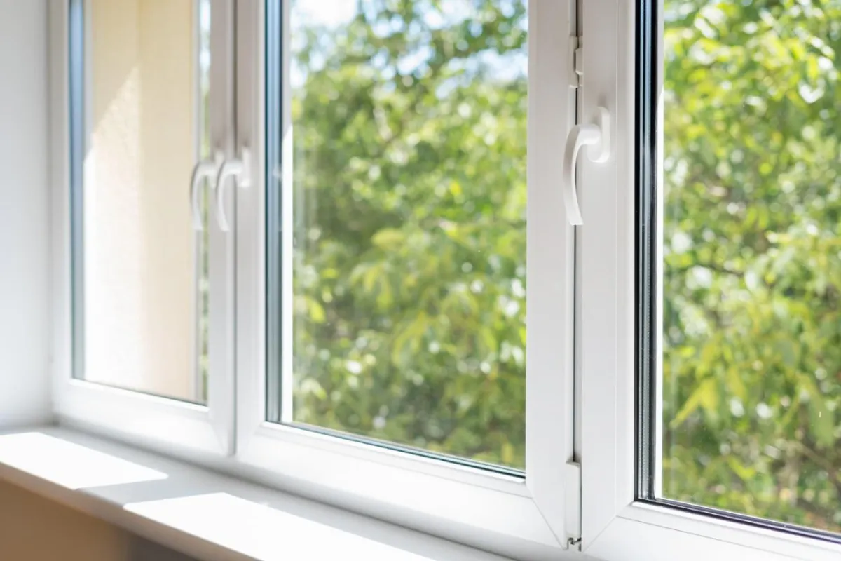Close view of a white window frame and glass