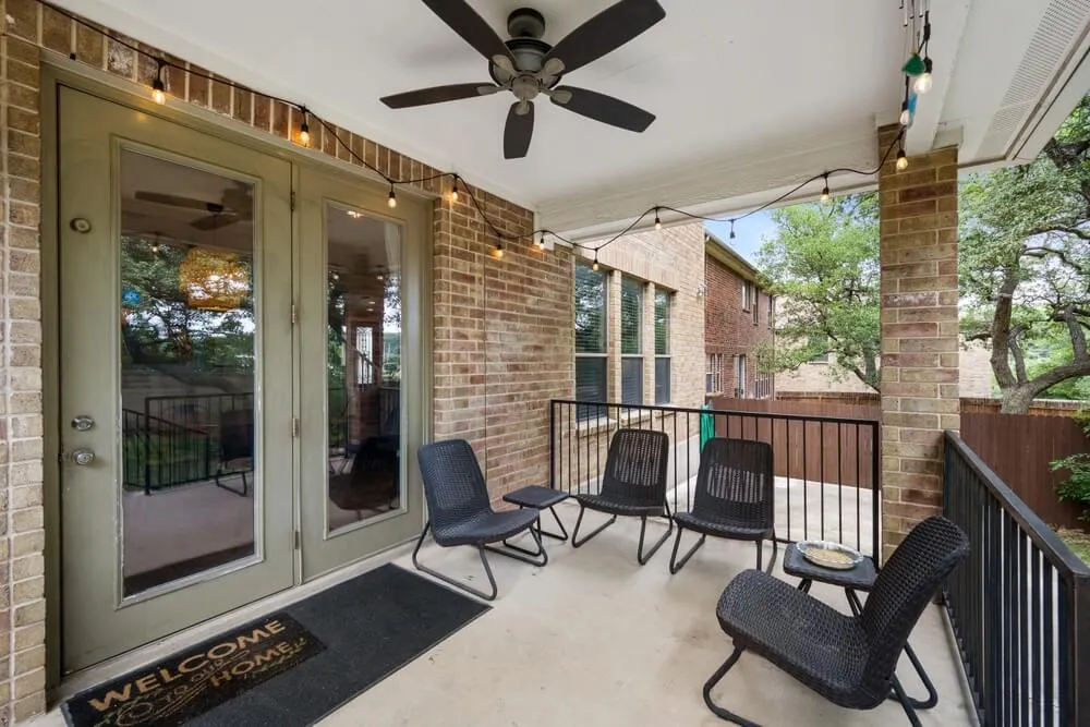 Covered patio with glass doors connecting to the home