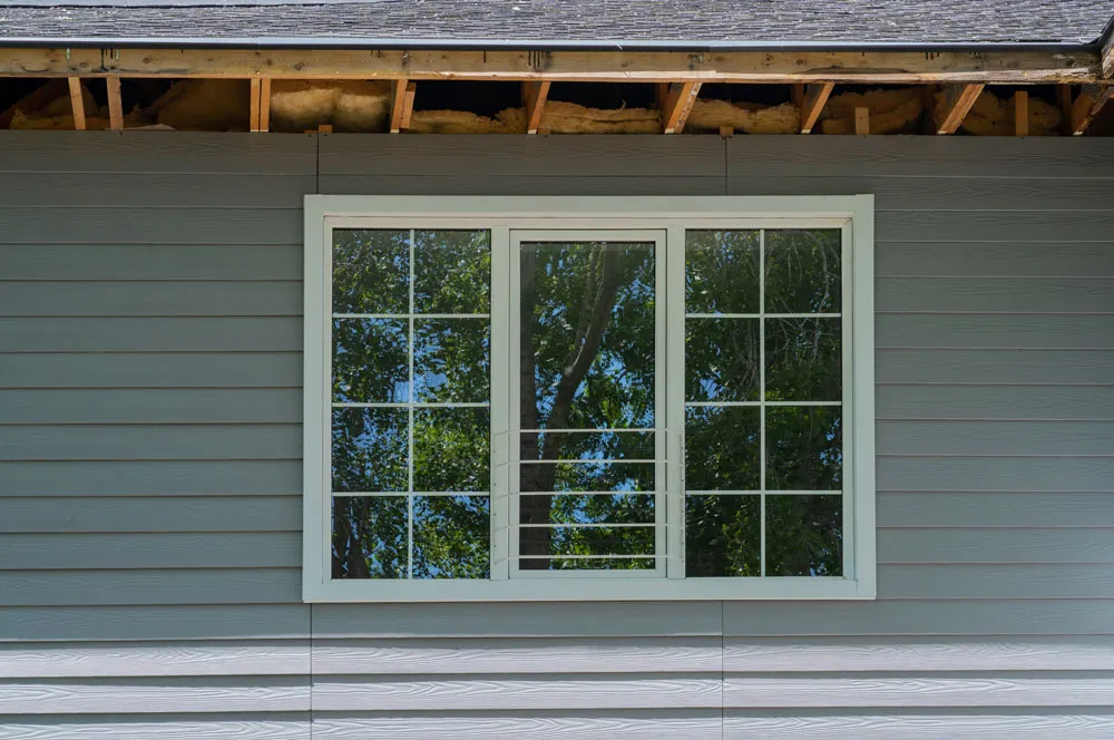 Wide white-framed window on a home exterior
