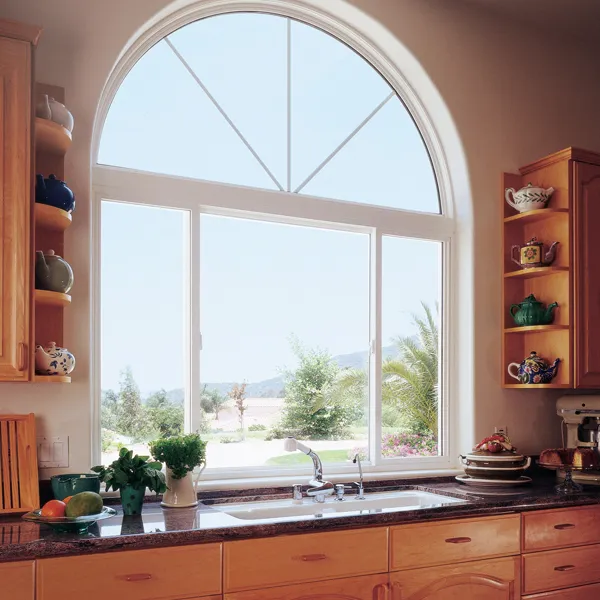 Large arched window above a kitchen sink